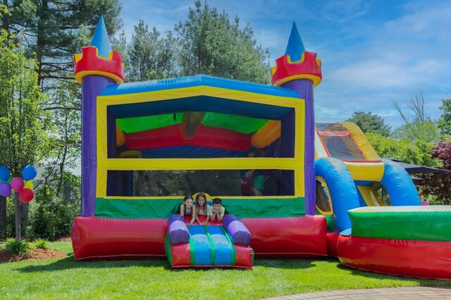 Kids playing at a bounce house