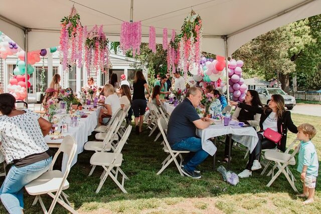 Tent party with tables and balloons