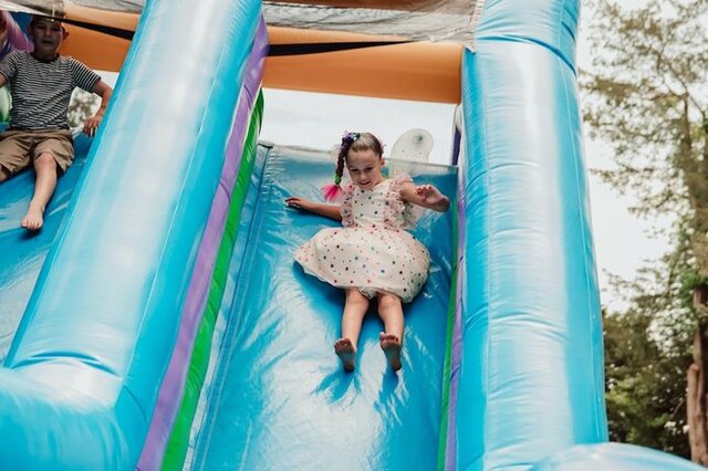 Girl on an inflatable slide